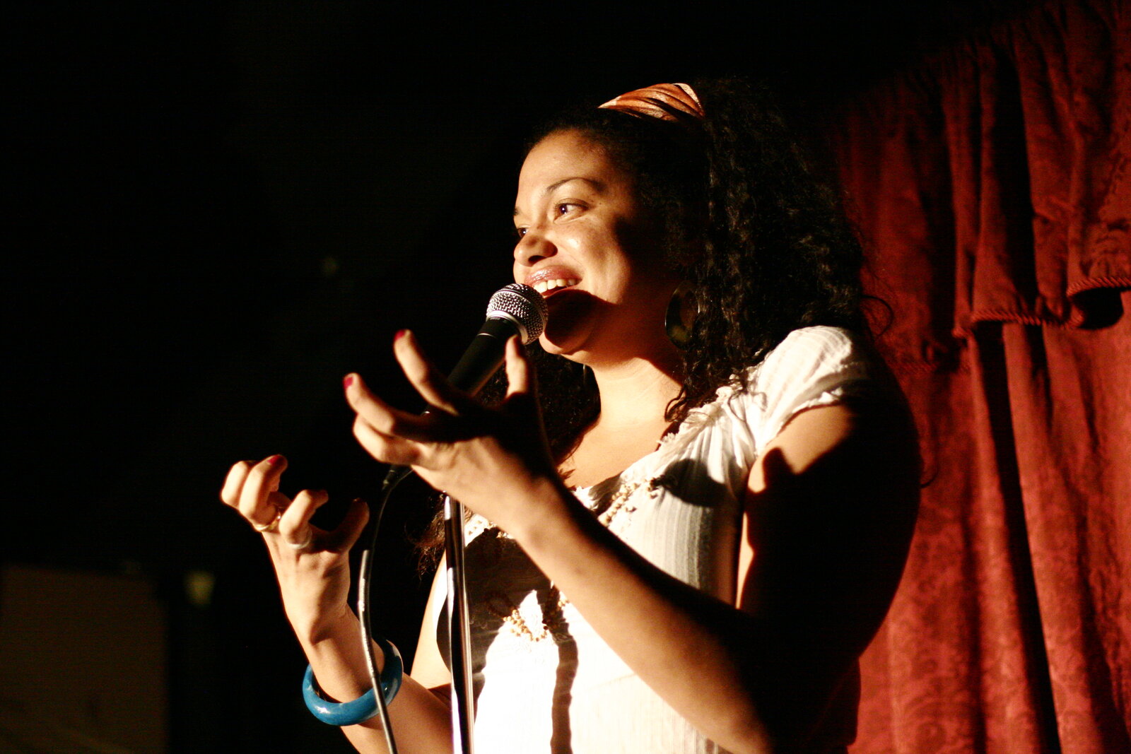 Michelle Buteau smiling at a public event