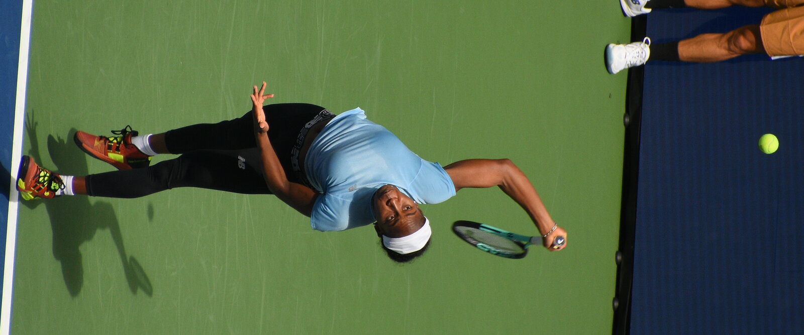 Coco Gauff practicing her tennis swing on court