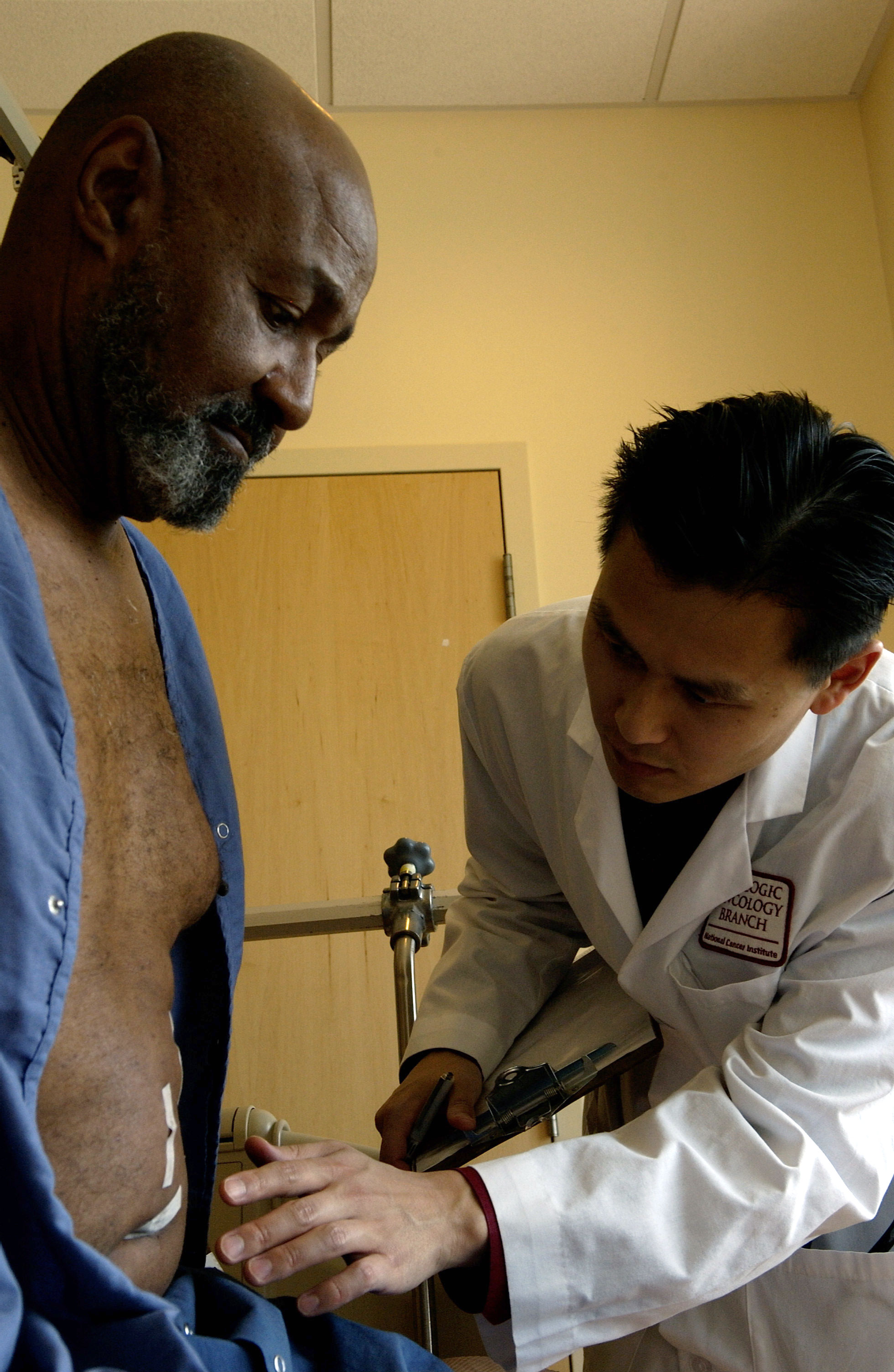 Physician discussing a screening plan with a Black patient