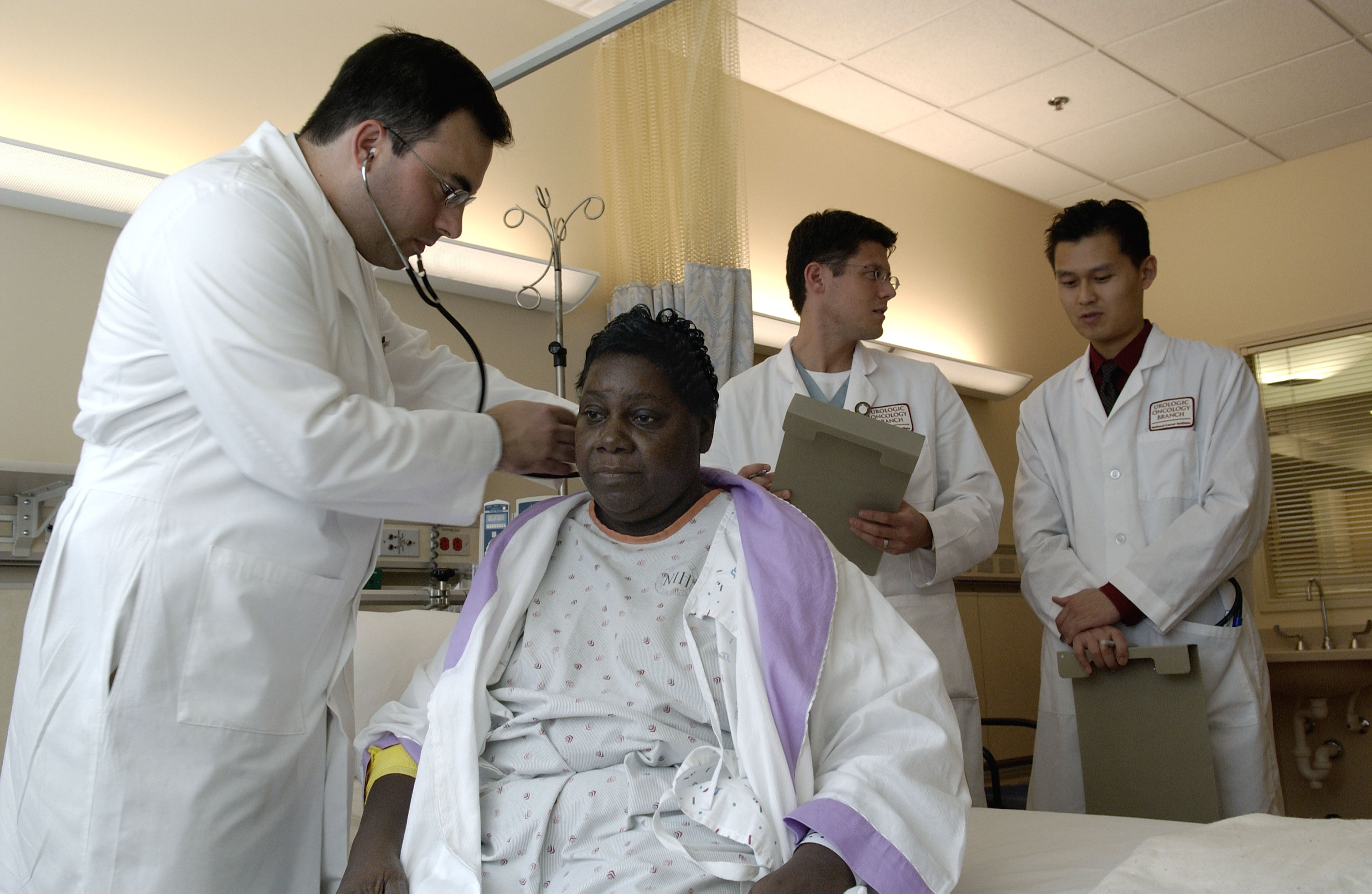 Physician reviewing lab test results with a Black patient