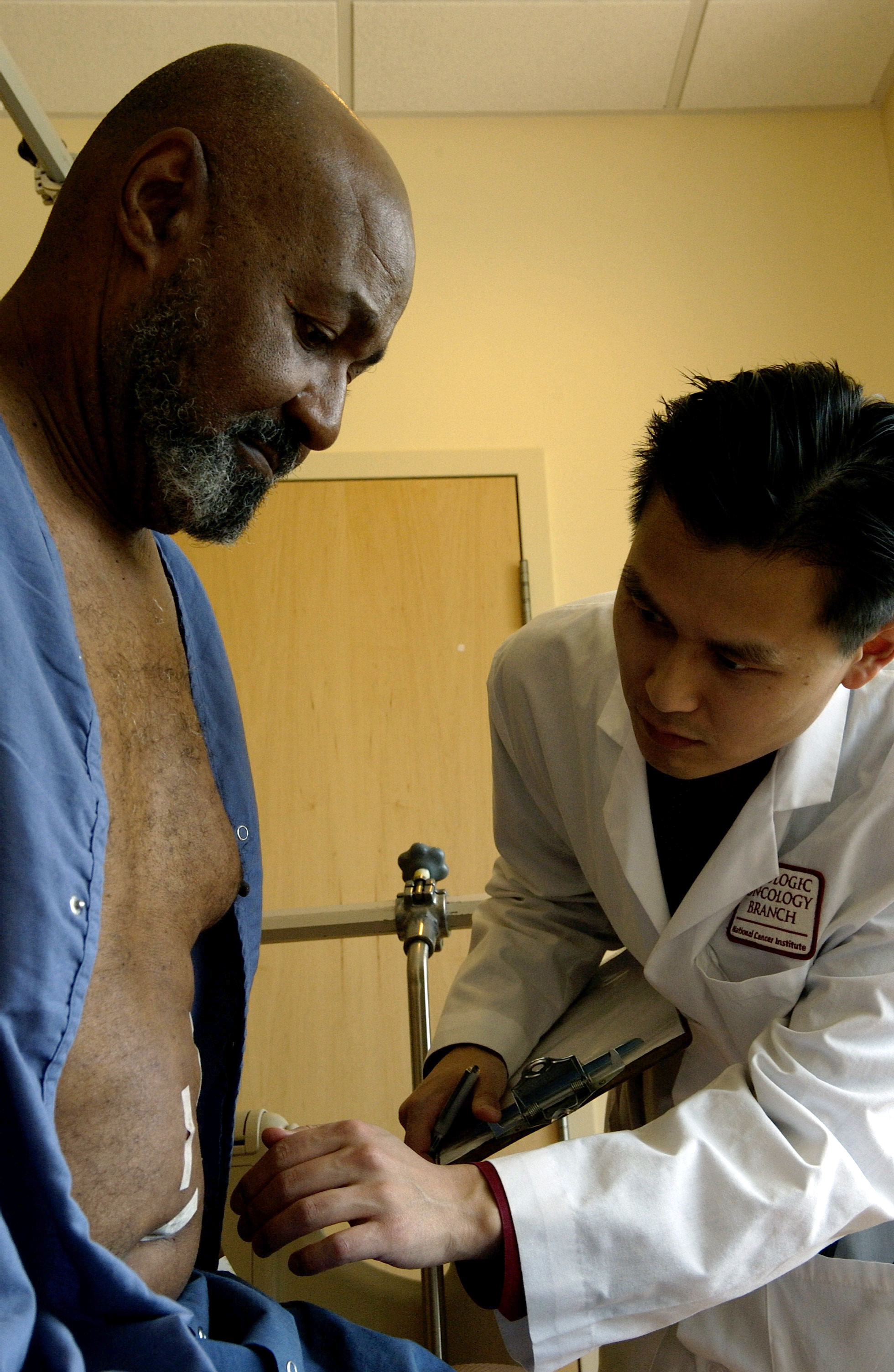 Doctor going over paperwork and next steps with a Black patient