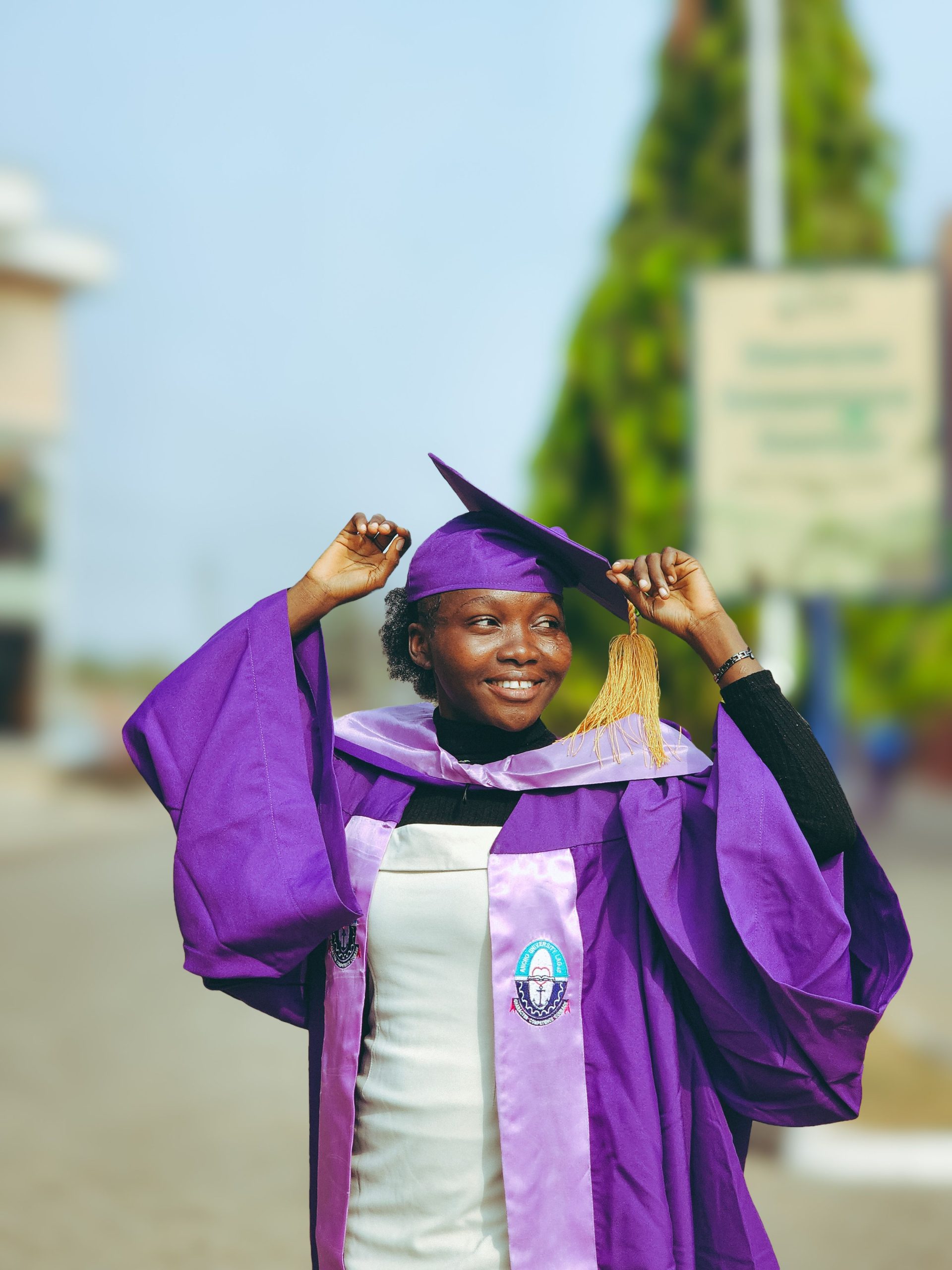 Students in graduation caps and gowns at a college ceremony