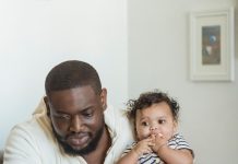 Opinion: ICE Raids Are Terrorizing Black Immigrant Communities Too Black father with his children at home