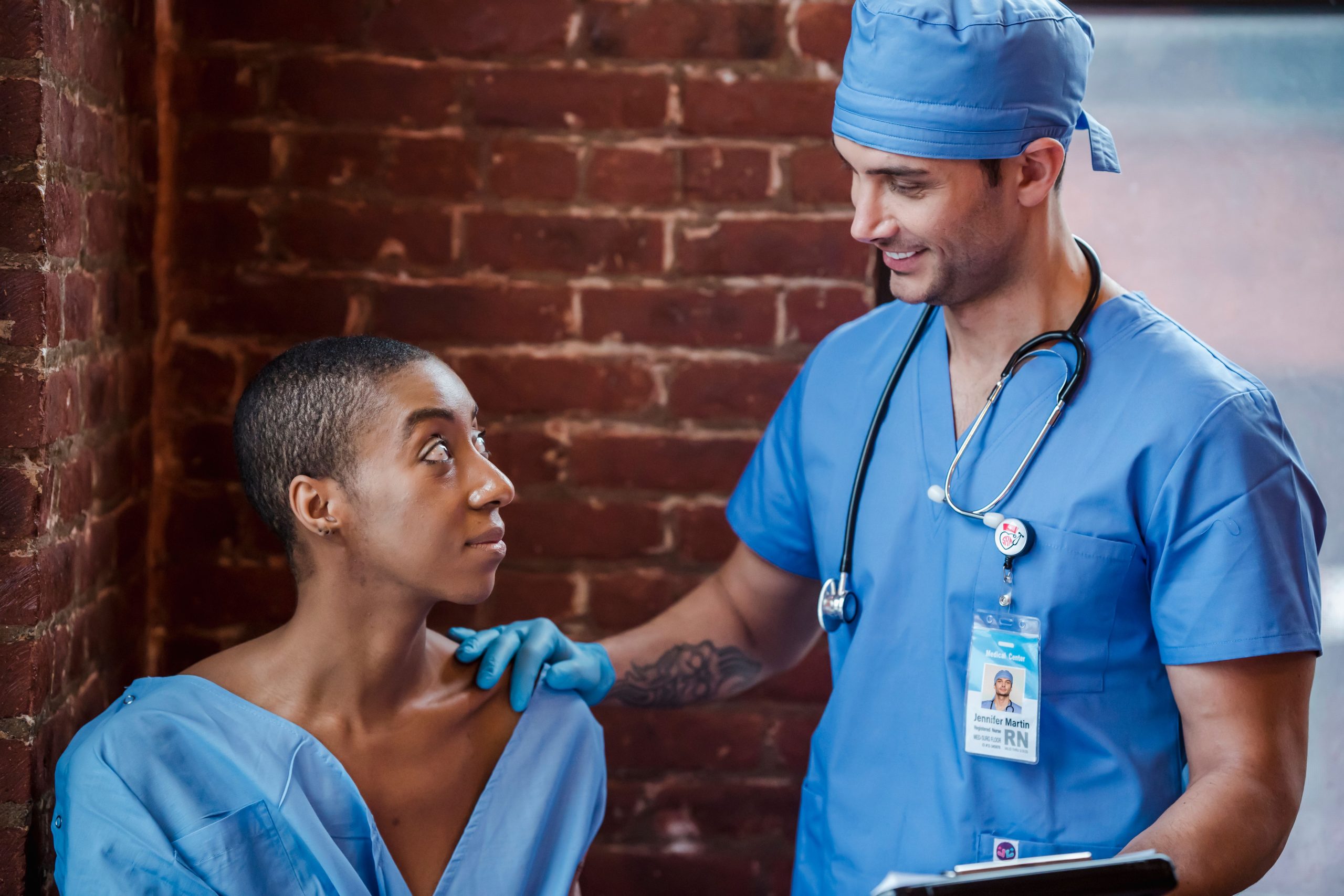 Doctor checking patient blood pressure in healthcare clinic