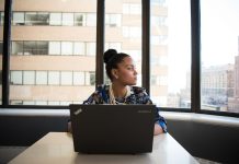 Black Unemployment Rate Climbs in 2026: What the Jobs Numbers Mean for You Black woman working on a laptop in an office
