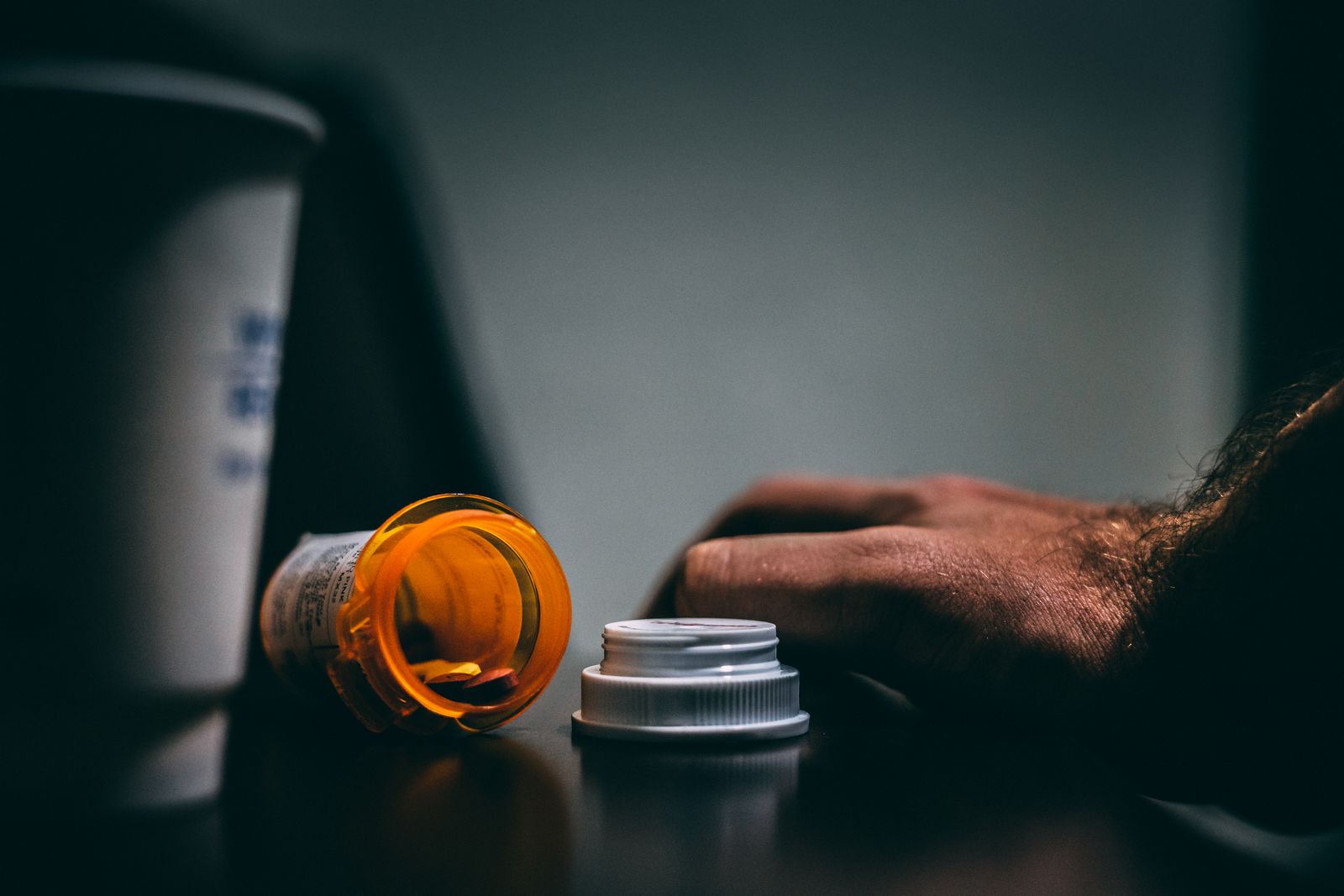 A prescription medicine bottle sitting on a table