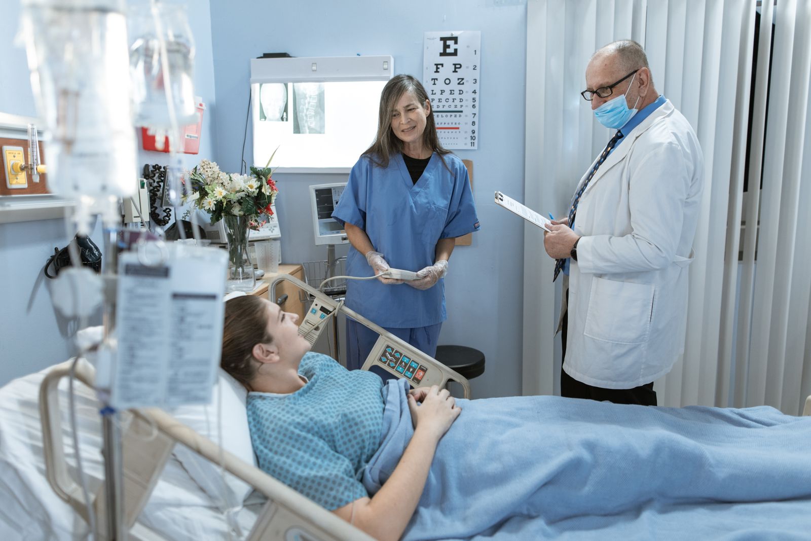 A doctor sitting with a patient during a medical appointment