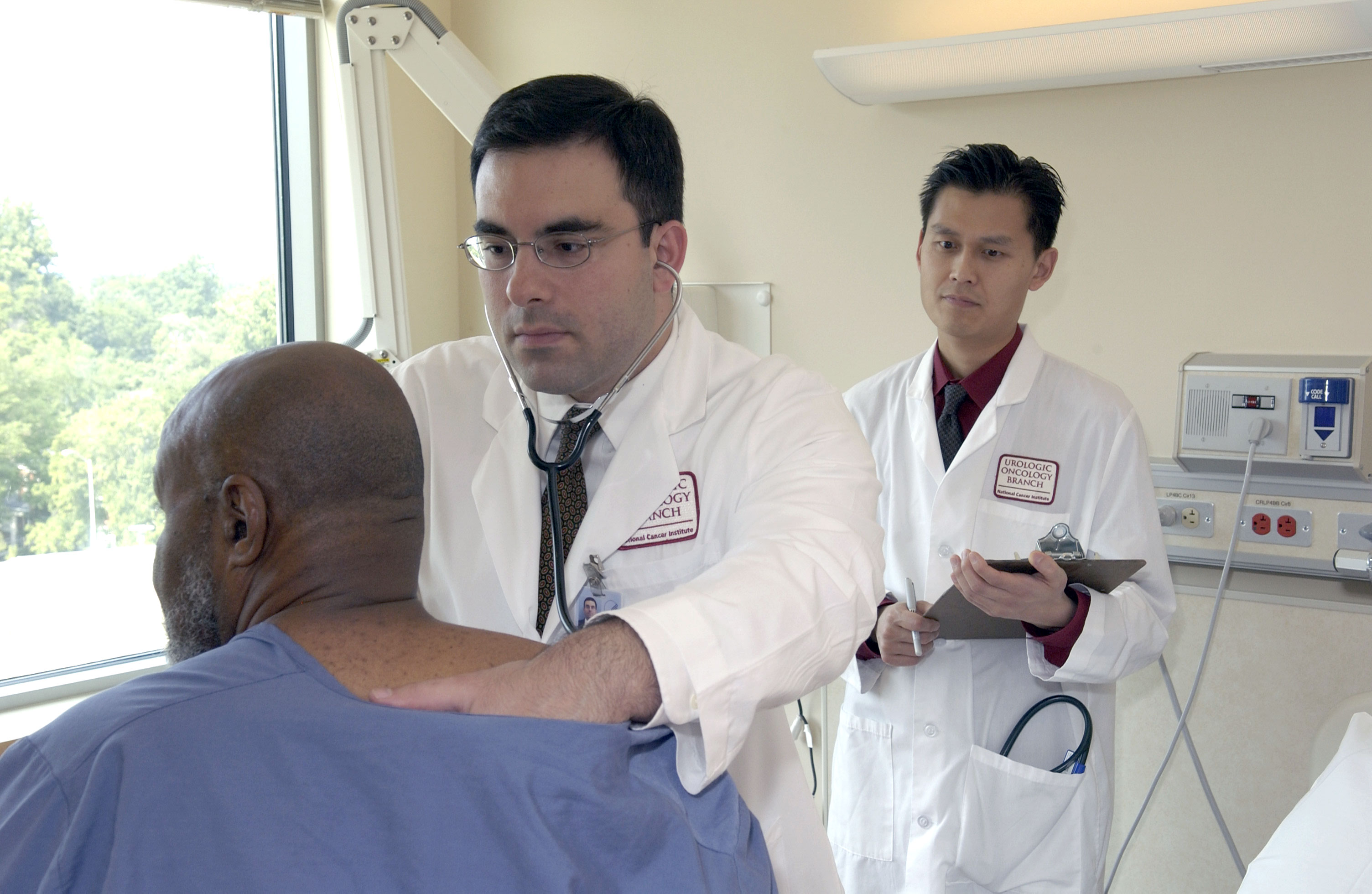 Black woman patient listening closely as her doctor explains a diagnosis