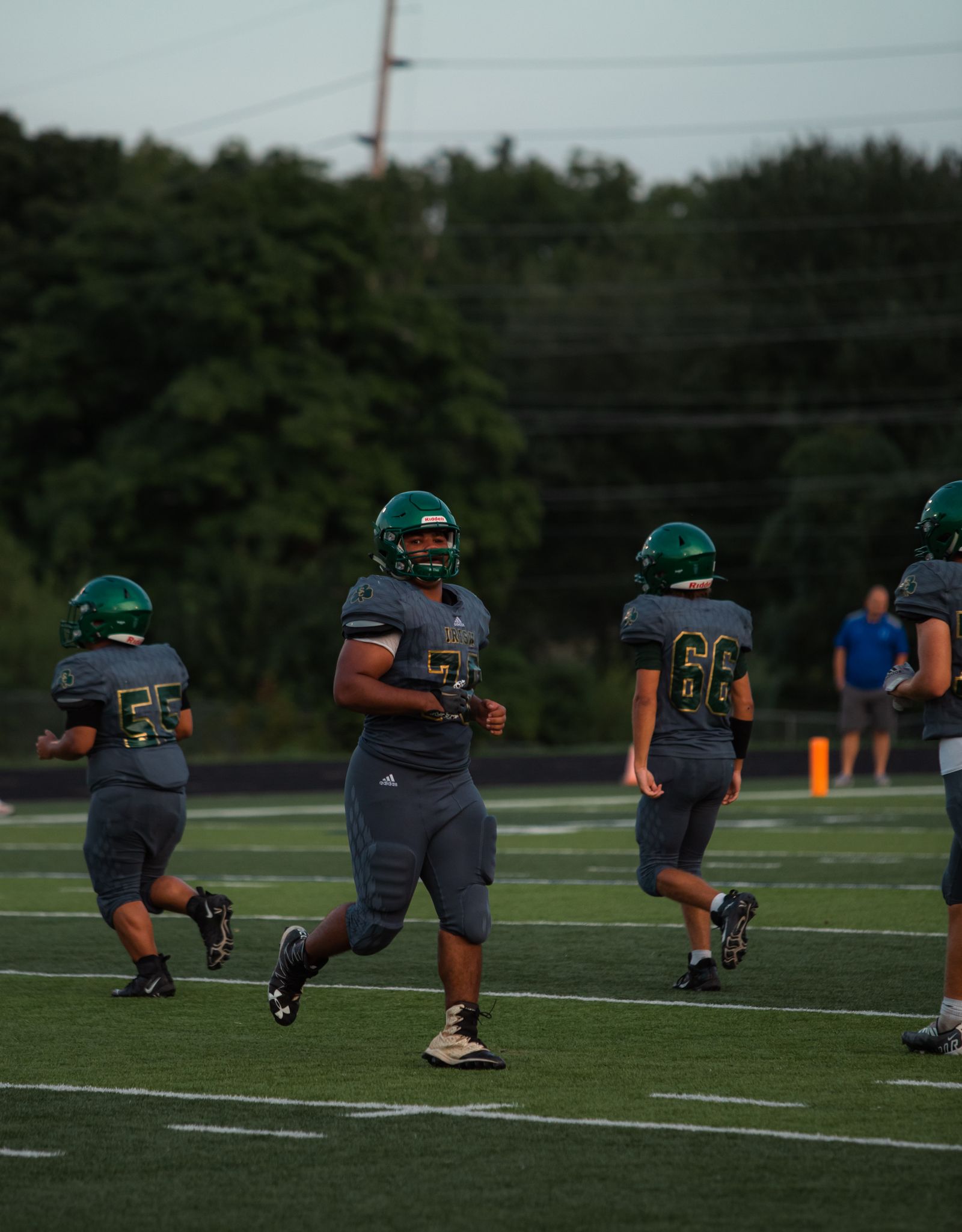 Football players in action on a stadium field