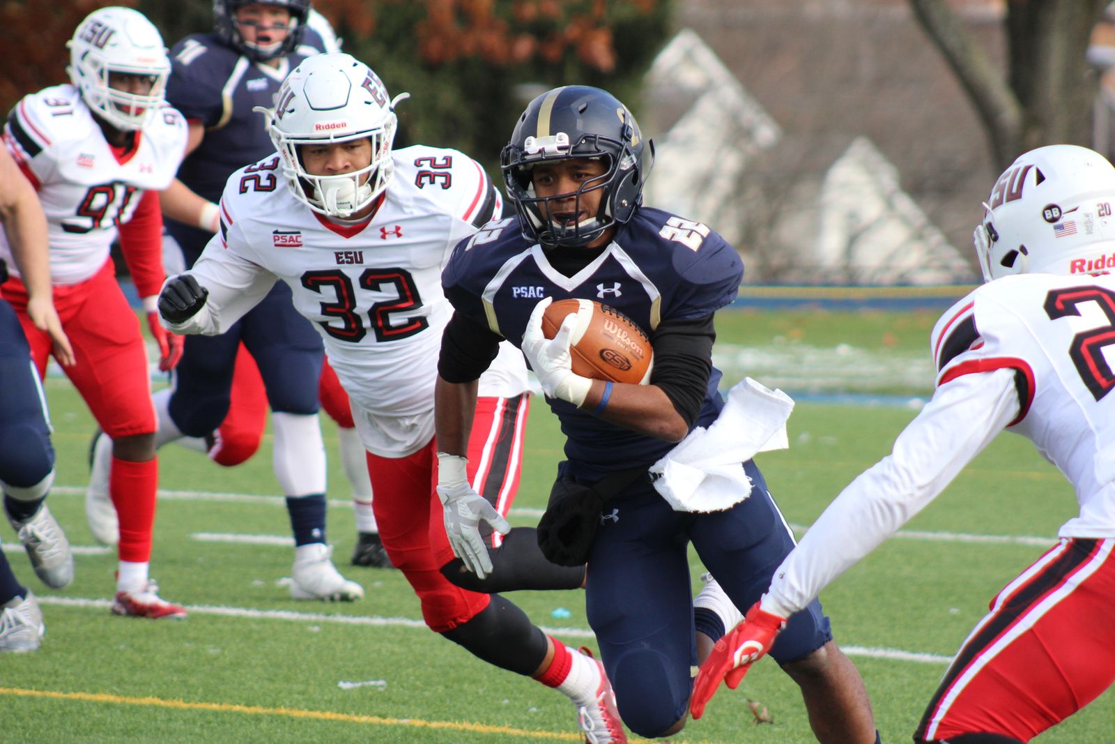 A football player carrying the ball during a game