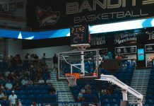 2026 WNBA All-Star Game: A Chicago Showcase and How to Watch A basketball hoop and scoreboard above a filled arena during a game