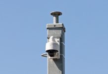Opinion: Facial Recognition Keeps Arresting the Wrong Black People A surveillance camera mounted on a wall, representing facial recognition and wrongful arrests of Black Americans