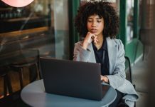 Verizon Digital Ready: Take Two Free Courses, Unlock a $10,000 Grant in 2026 A focused Black woman small-business owner working on a laptop