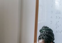 Get Paid to Learn Tech: New 2026 AI Apprenticeships Open Doors Without a Degree A Black woman learning tech skills on a laptop in a training classroom