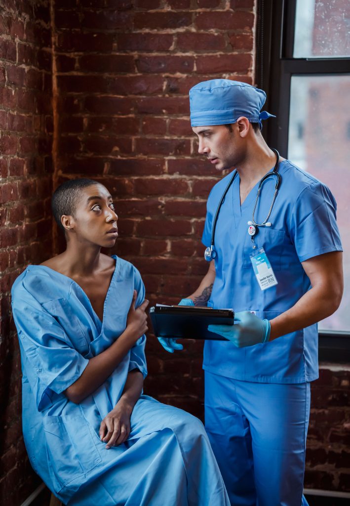 Black patient with African American medical staff