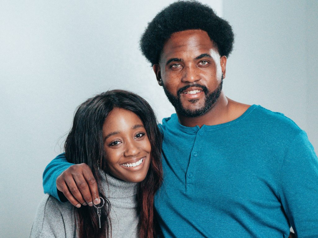 Happy African American couple celebrating their new home