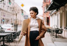 Opinion: Medicaid Cuts Are a Black Maternal Health Emergency in Slow Motion A pregnant Black woman cradling her belly, illustrating the stakes of Medicaid cuts for Black maternal health
