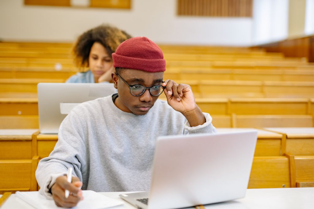Black student studying on a laptop