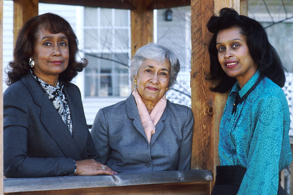 Three generations of an African American family, grandmother, mother and daughter, together