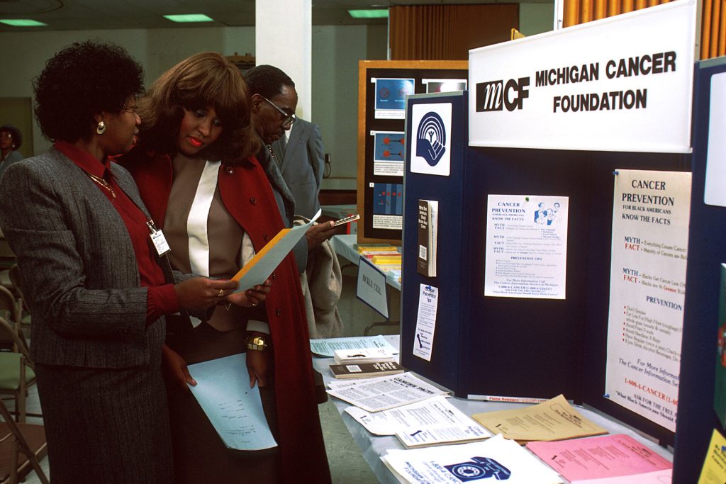 Black men and women attending a community health fair