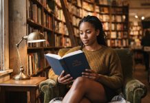 Books by Black Authors This Fall: 12 New Reads for Sept. to Nov. A Black woman reading a hardcover book in an armchair inside a cozy independent bookstore